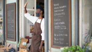 A Happy Store Clerk at a Strore front